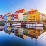 Colorful buildings and historic boats along Copenhagen’s Nyhavn canal, a familiar scene for Americans living in Denmark.