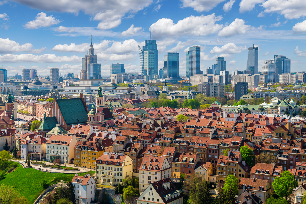 Aerial view of Warsaw’s Old Town and modern skyline, capturing the city environment experienced by Americans living in Poland.