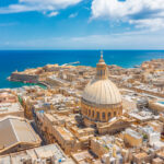 Aerial view of Valletta’s historic churches and rooftops, a familiar cityscape for Americans living in Malta.