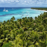 Saona Island’s bright blue water and tropical shoreline reflect the beach lifestyle enjoyed by Americans living in Dominican Republic.