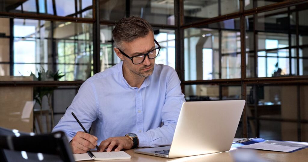 Cons of renouncing US citizenship - US expat reviewing list of required materials to renounce on his laptop.