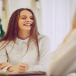 A happy customer sitting at a table