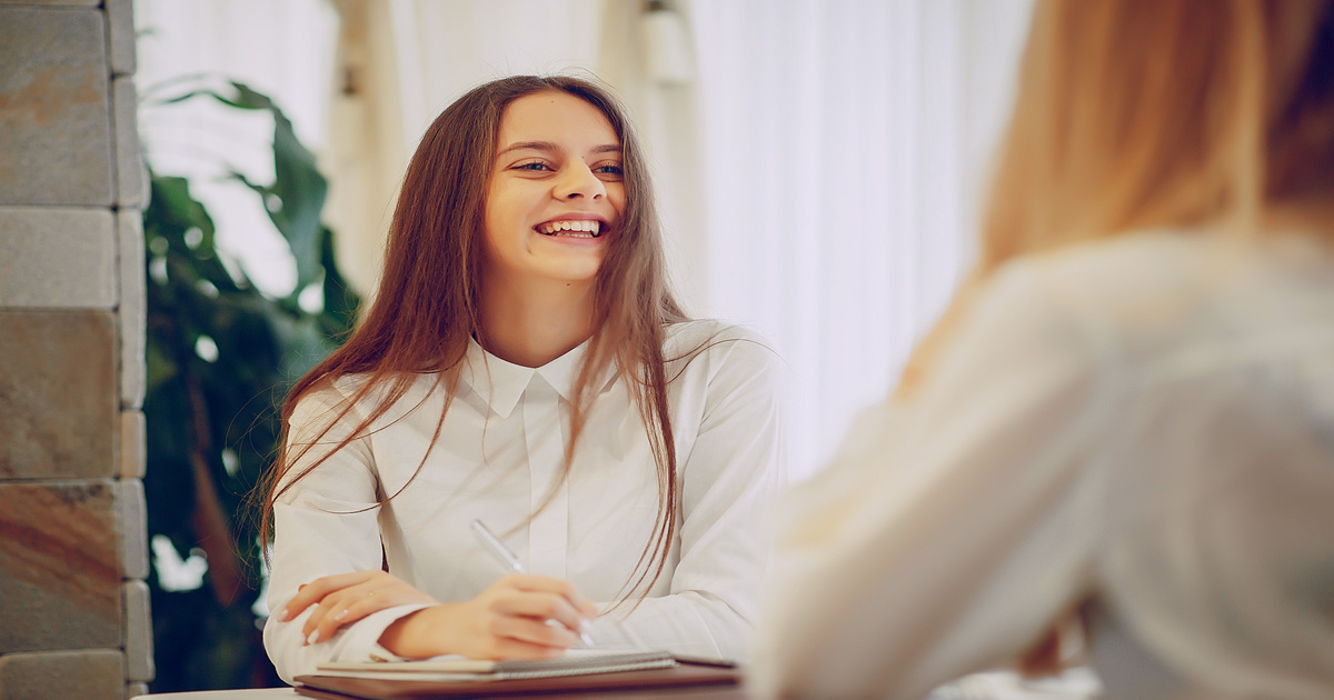 A happy customer sitting at a table