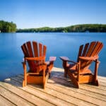 Wooden dock and calm water in Ontario—perfect setting to think about retirement options, including an IRA in Canada.