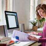 US expat doing her expat taxes at her desk.