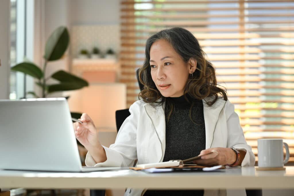 Professional woman learning about U.S. tax options for businesses, including how to file Form 8832.