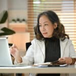 Professional woman learning about U.S. tax options for businesses, including how to file Form 8832.