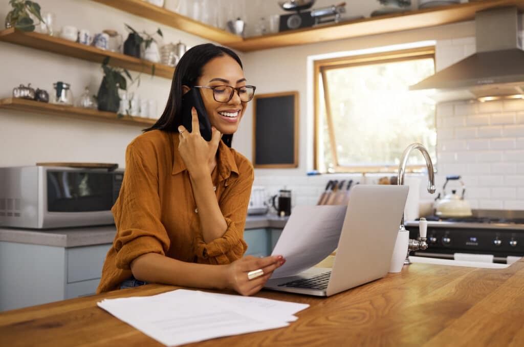 Woman on a laptop representing the paperwork involved in Streamlined Foreign Offshore Procedures for U.S. expats.