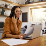 Woman on a laptop representing the paperwork involved in Streamlined Foreign Offshore Procedures for U.S. expats.