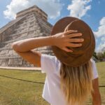Digital nomad looking at pyramid in Mexico