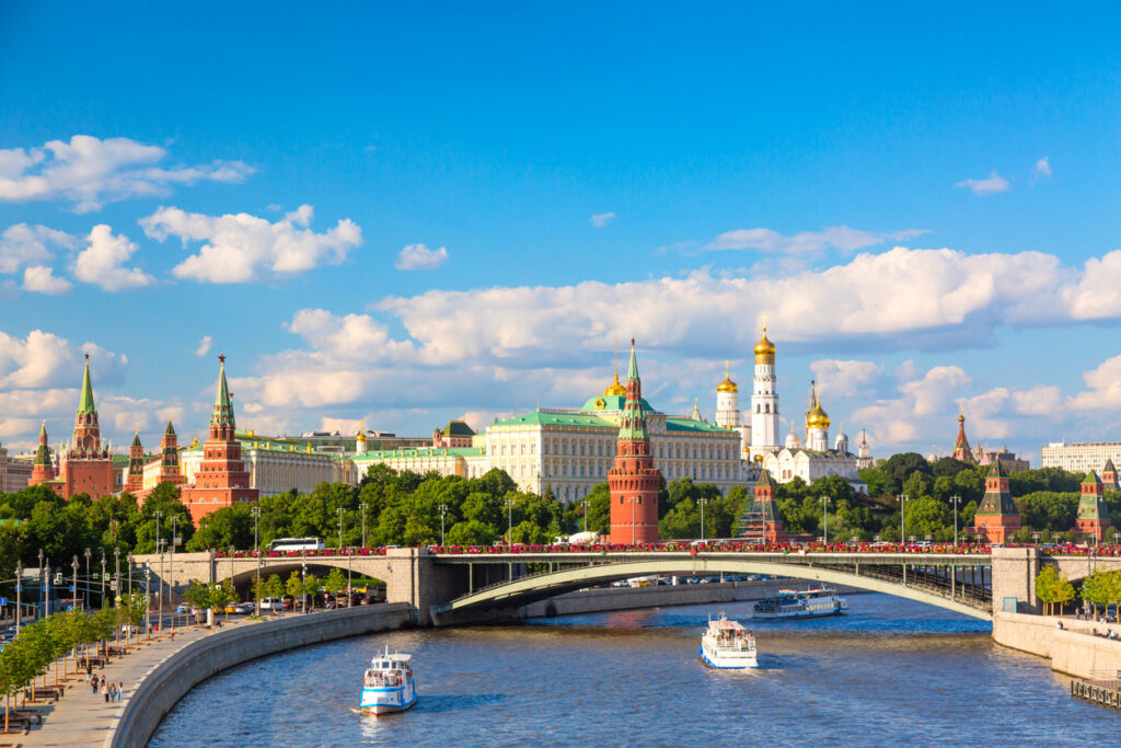 Summer view of the Moscow Kremlin, river and sightseeing boats, a familiar cityscape for Americans living in Russia.