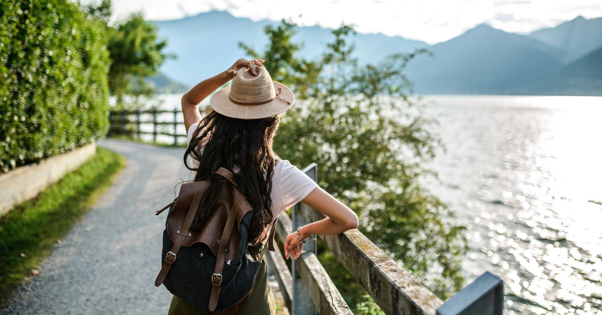 US citizen looks out over a lake.