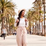 Carefree traveler enjoying a beach town—unaware that citizenship based taxation may still apply while living abroad.