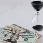 hourglass and US dollars, its time to plan year-end US expat taxes