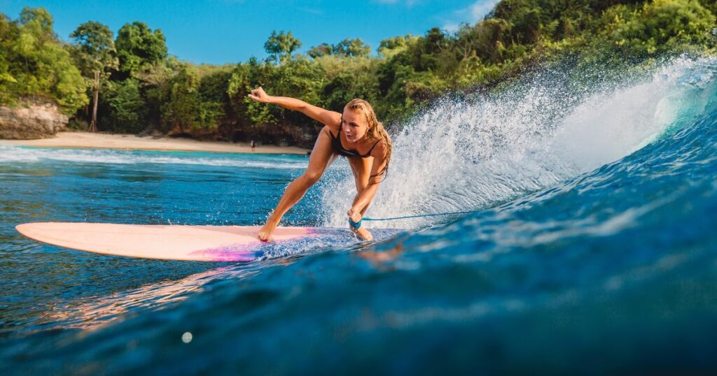 Woman surfing in Bali