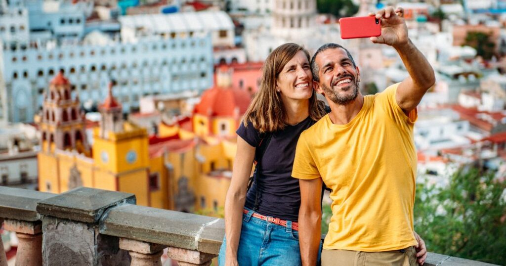 Couple taking a selfie in a city in Mexico