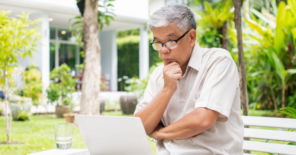 Older gentleman considering filing his US expat tax extension online meets with a Bright!Tax CPA for reassurance.