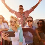 Young people take a selfie on a roadtrip in Australia, enjoying their working holiday.