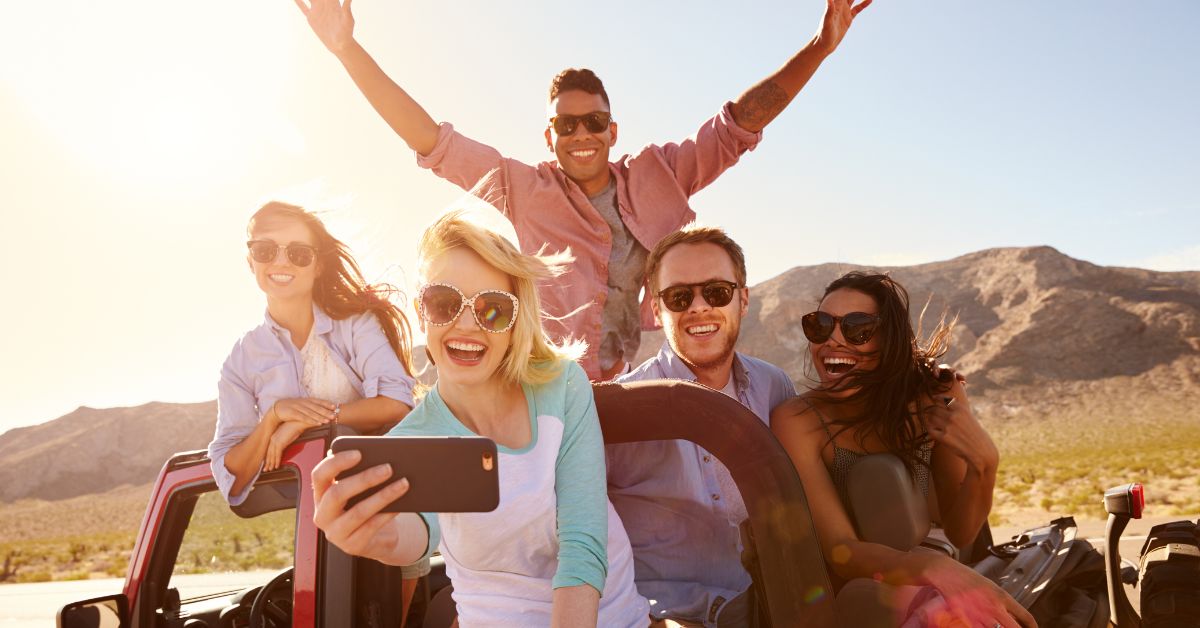 Young people take a selfie on a roadtrip in Australia, enjoying their working holiday.