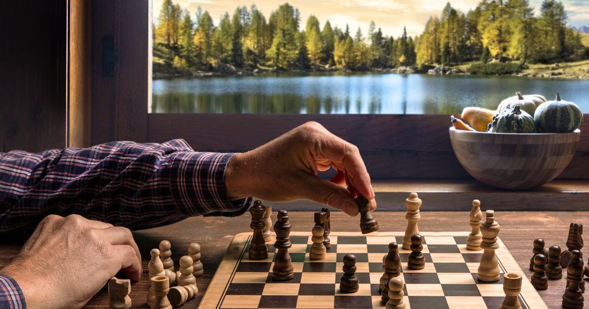 US expat plays chess, a visual analogy of the strategy necessary behind changing state residency when living abroad.