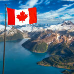 Aerial view of Garibaldi Lake with Canadian flag overlay—an iconic landscape for anyone earning taxable income in Canada.