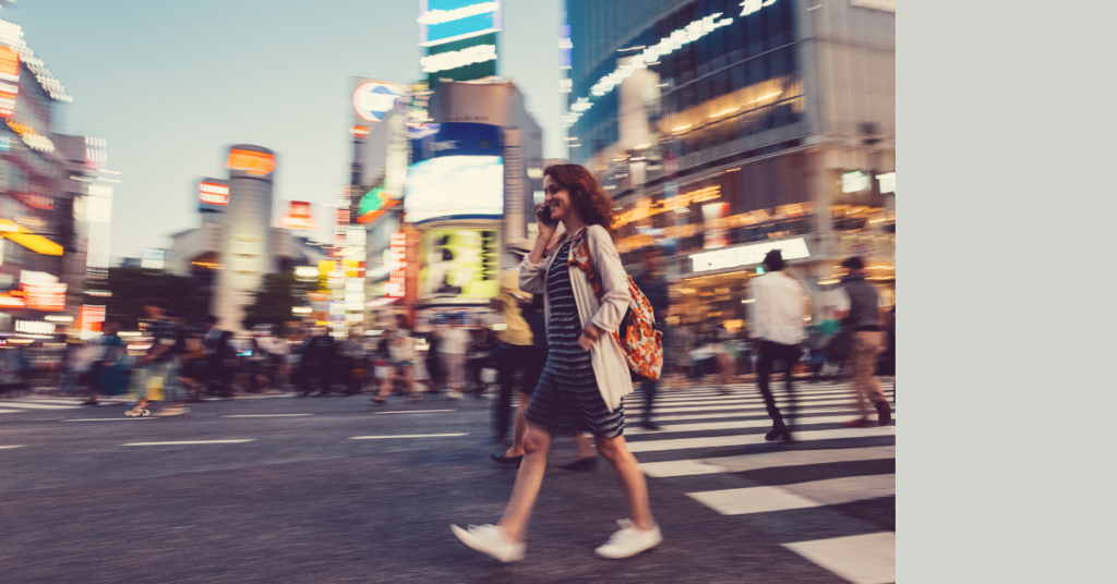 Woman walking in a city in Japan.