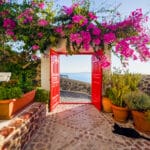 Charming patio in Santorini, Greece—an idyllic setting that prompts the question: what is a golden visa and how can it lead to residency?