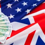 American flag and cash money, representing the financial ties covered by the US UK tax treaty.