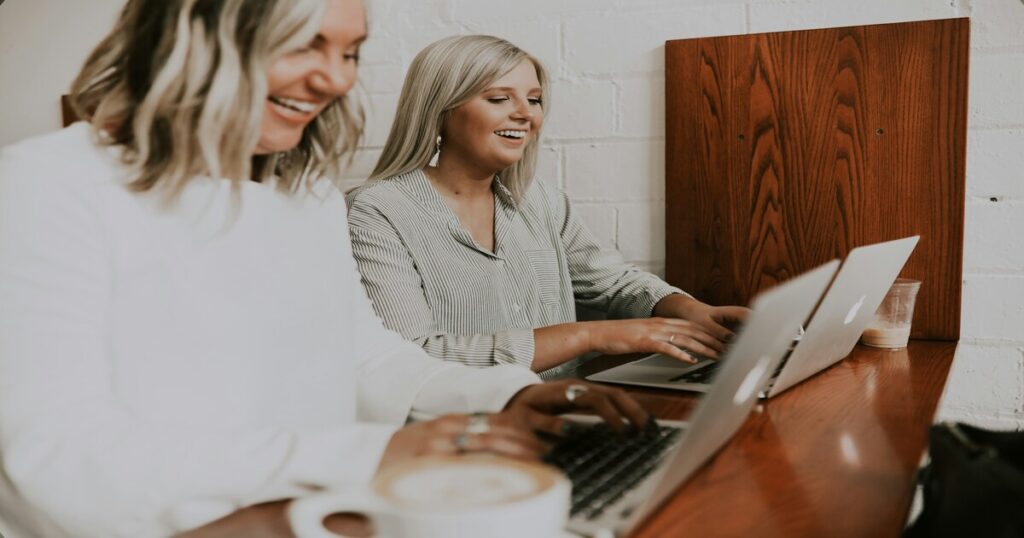 women working on their laptops