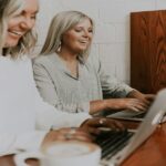 women working on their laptops