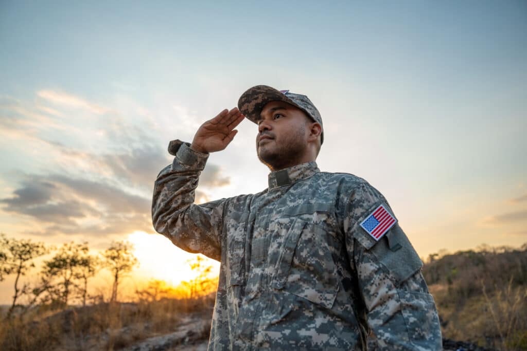 U.S. military service member in uniform, representing those eligible for tax benefits like the combat zone exclusion.