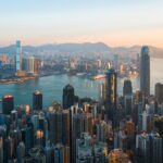 Dramatic skyline of Hong Kong at dawn, showcasing the fast-paced urban life for Americans living in Hong Kong.