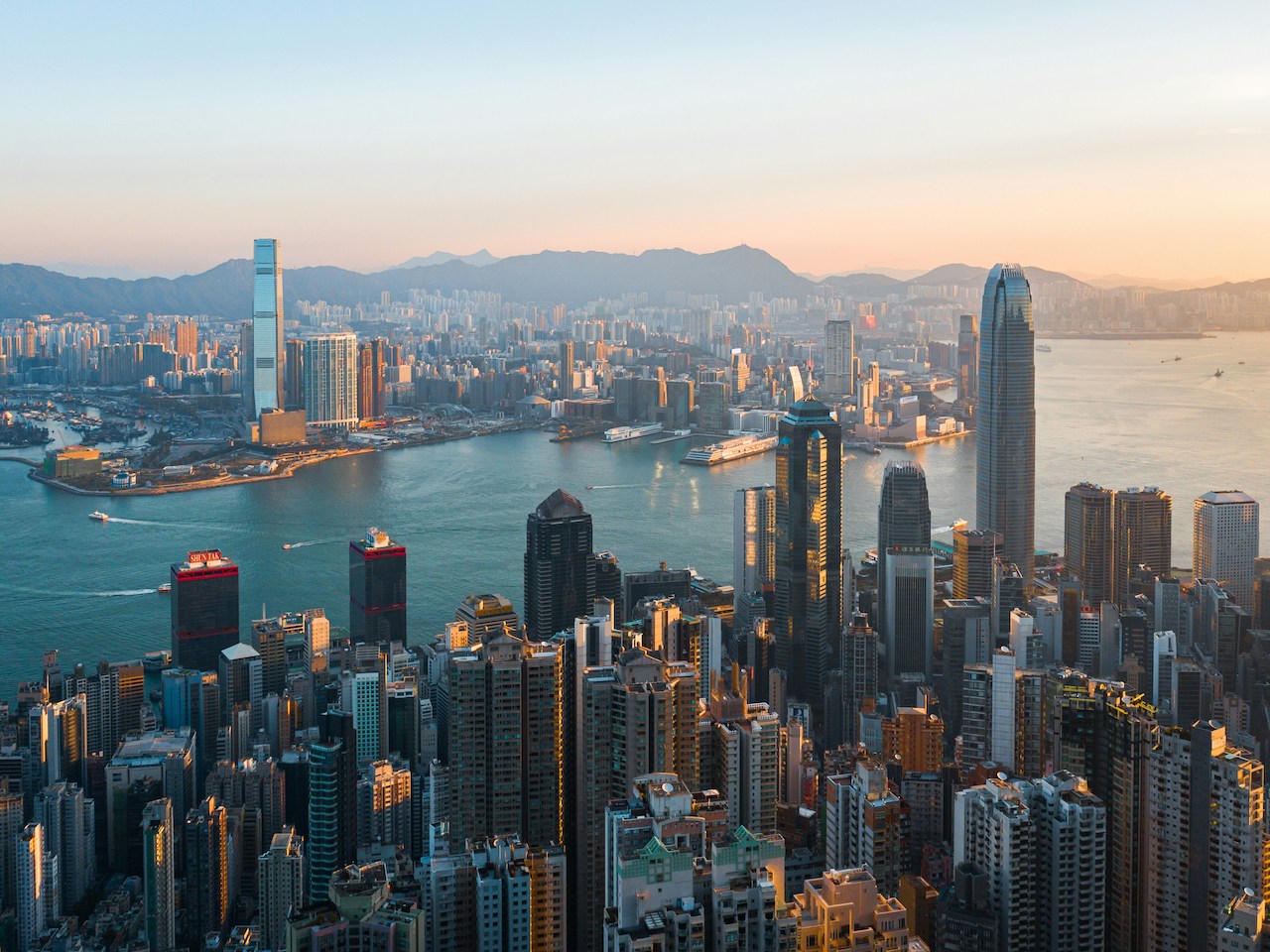 Dramatic skyline of Hong Kong at dawn, showcasing the fast-paced urban life for Americans living in Hong Kong.