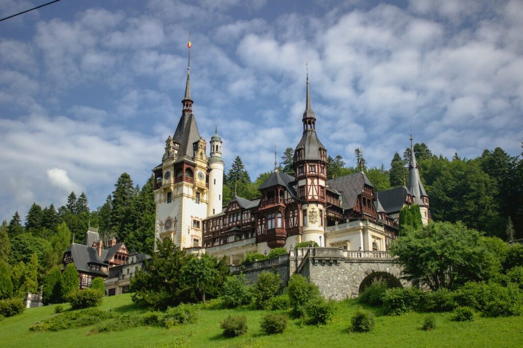 Hilltop castle under cloudy skies, echoing the historic beauty explored by Americans living in Romania.