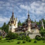 Hilltop castle under cloudy skies, echoing the historic beauty explored by Americans living in Romania.