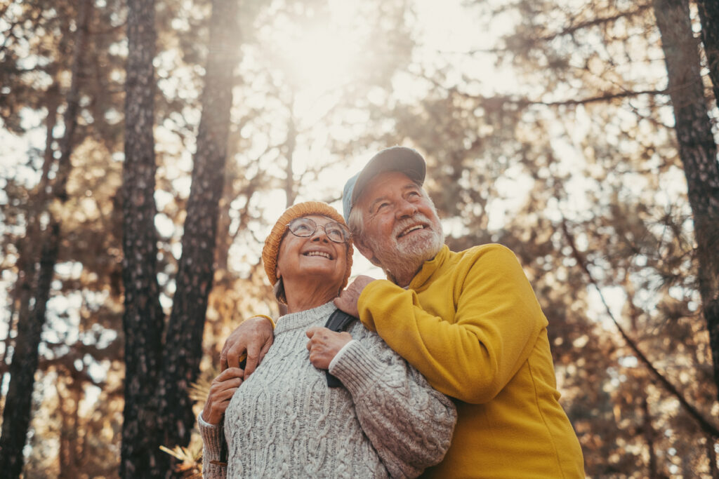 Happy retirees enjoying the outdoors while exploring how to retire in Canada as an American.