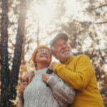 Happy retirees enjoying the outdoors while exploring how to retire in Canada as an American.