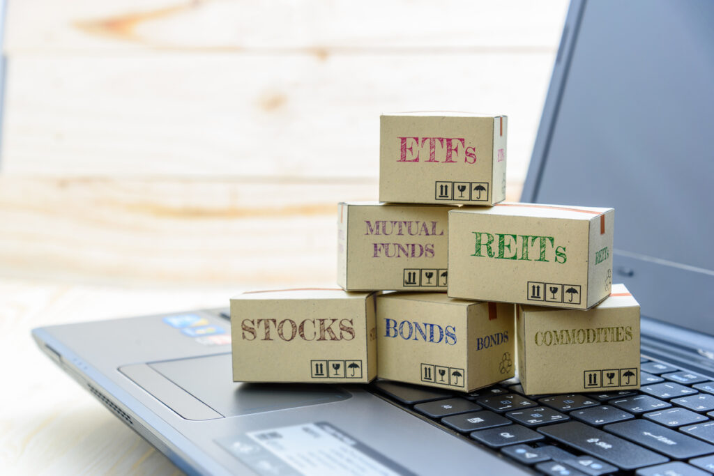Laptop displaying a range of investment options like ETFs and mutual funds—reminders of what may need to be reported on a PFIC form.