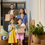 Family moving into their new Canadian home, navigating life changes after a US to Canada conversion of savings and income.
