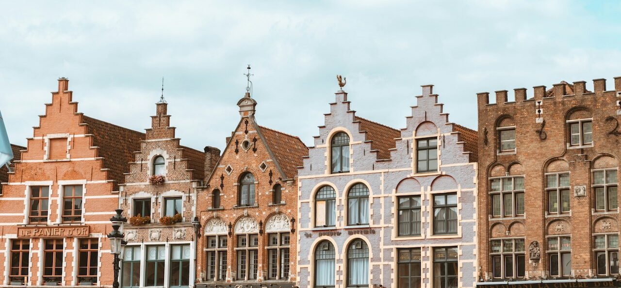 Modern concrete buildings under clear skies, reflecting the urban landscape familiar to Americans living in Belgium.