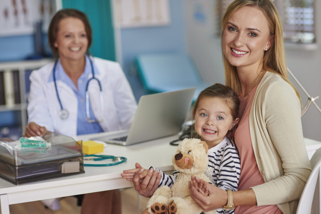 Child at a medical appointment, receiving care through the UK healthcare system.