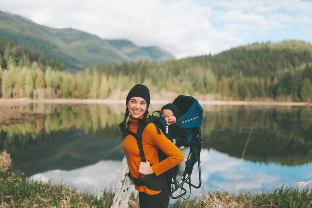 Mother and baby share a joyful moment outdoors, capturing everyday life for Americans living in Canada.