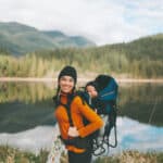 Mother and baby share a joyful moment outdoors, capturing everyday life for Americans living in Canada.