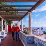 Overlooking the ocean, a couple contemplates double taxation on international earnings.