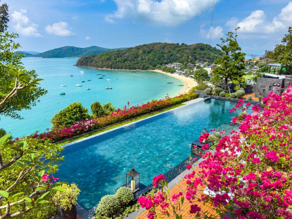 Tropical poolside view in Phuket, reflecting the serene lifestyle many seek when they retire in Thailand.
