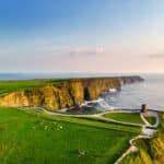 Stunning aerial view of the Cliffs of Moher, reflecting the natural beauty that draws many to retire in Ireland.