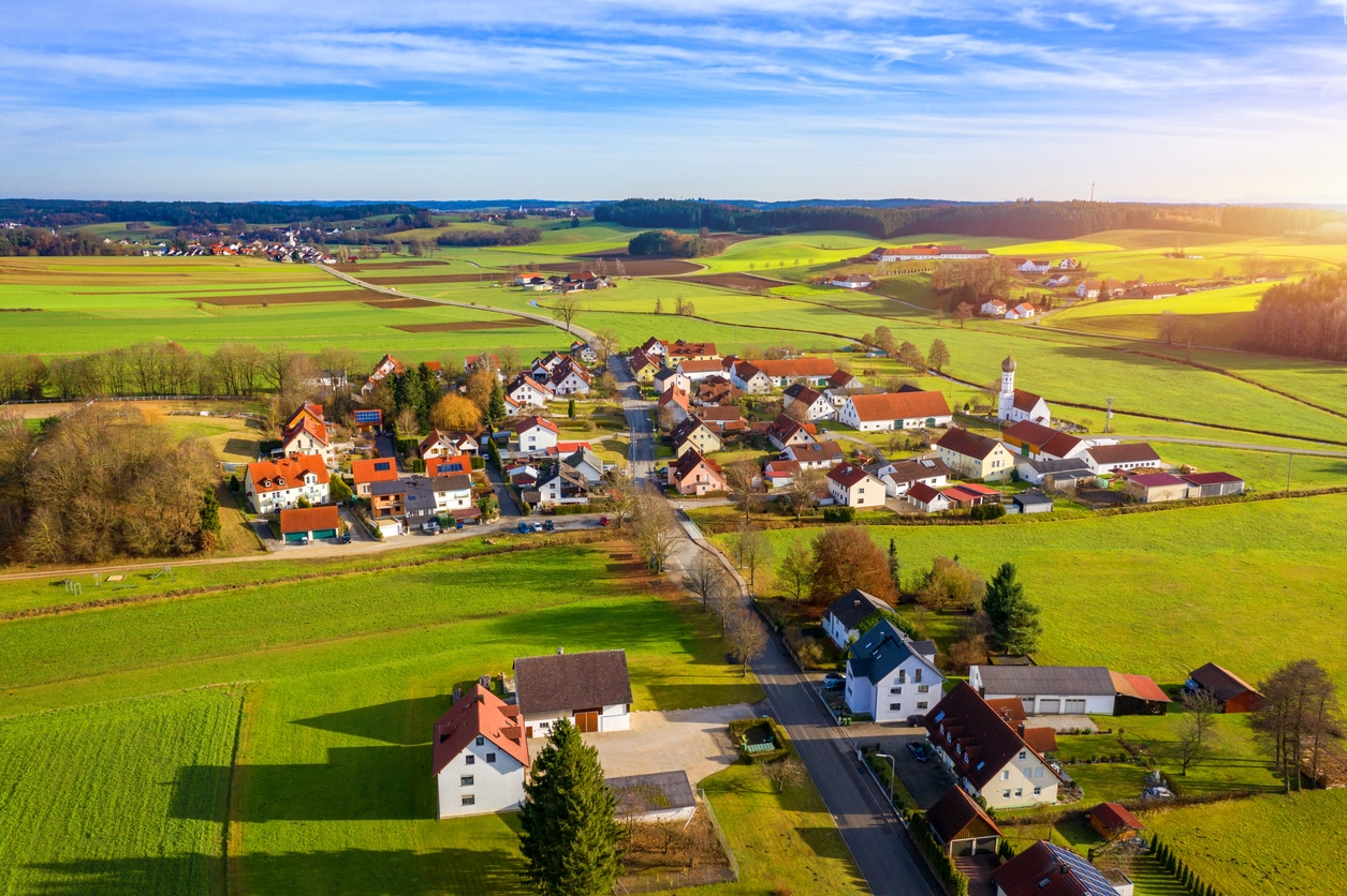 Aerial view of a Bavarian village, reflecting the peaceful countryside lifestyle many consider when buying a house in Germany.