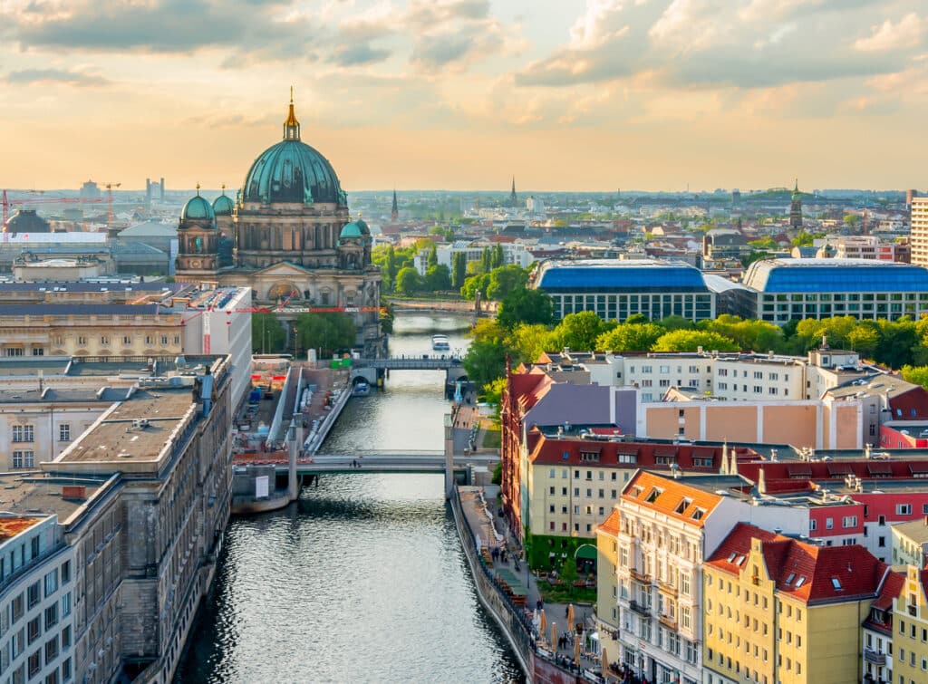 Sunset view of Berlin Cathedral along the Spree River, a symbolic setting for international financial agreements like the US Germany tax treaty.