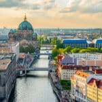 Sunset view of Berlin Cathedral along the Spree River, a symbolic setting for international financial agreements like the US Germany tax treaty.