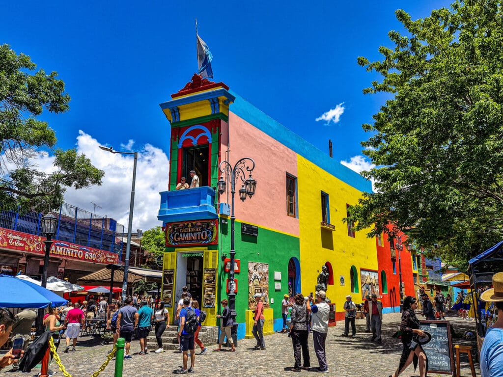 Colorful buildings along Caminito in Buenos Aires, capturing the vibrant neighborhood life experienced by Americans living in Argentina.